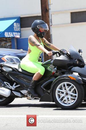 Amber Rose Goes All Out For "How to Be a Bad B****" Book Cover
